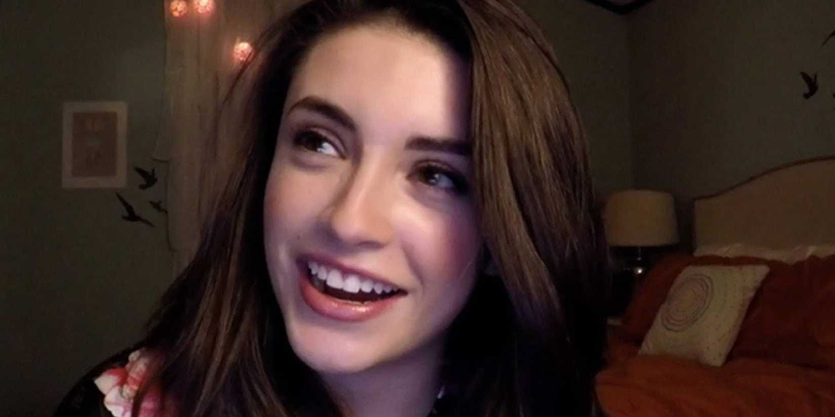 a close up of a girl with brown hair smiling in Face 2 Face