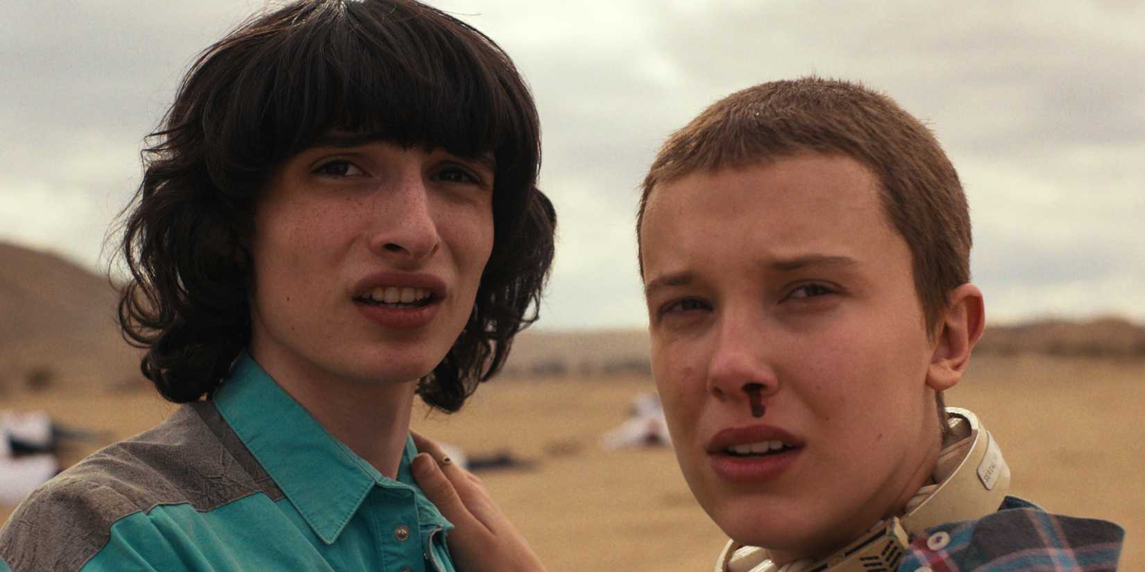 Finn Wolfhard as Mike Wheeler and Millie Bobby Brown as Eleven in STRANGER THINGS