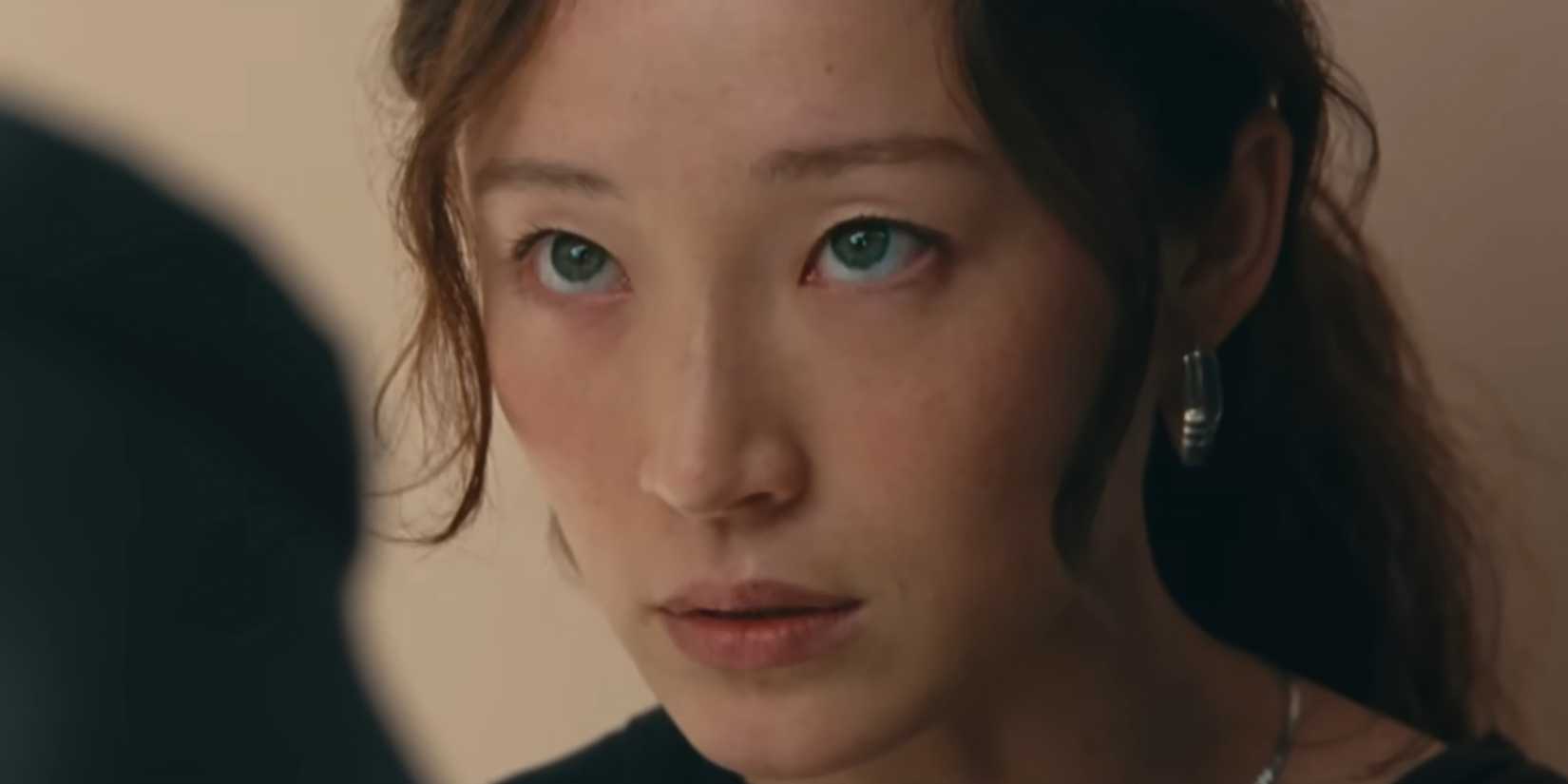 Havana Rose Liu as Shai looking seriously at Matthew in Lurker