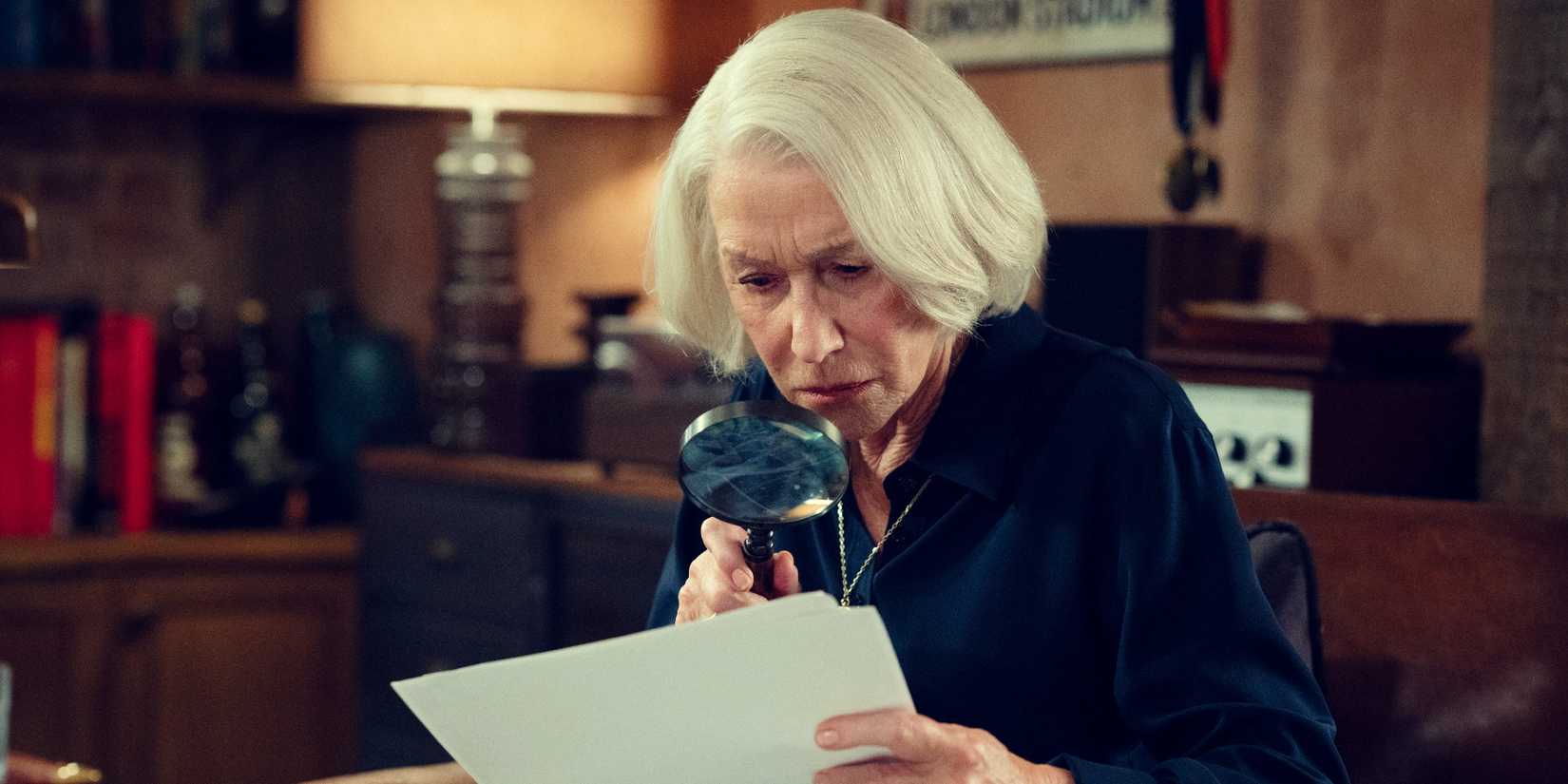 Helen Mirren as Elizabeth using a magnifying glᴀss in The Thursday Murder Club