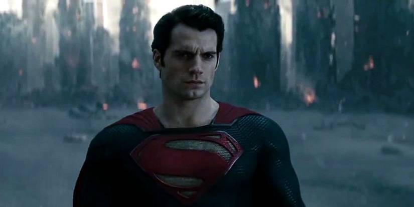 Henry Cavill's Superman stands in front of Metropolis' destruction in Man of Steel