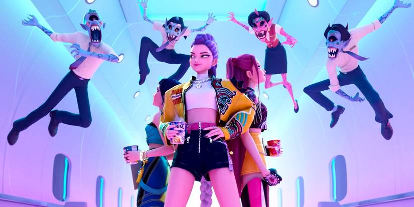 Huntrx standing back to back as demons leap toward them in KPop Demon Hunters