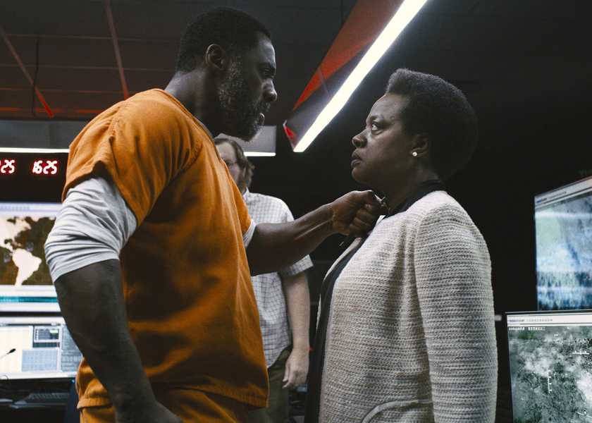 Idris Elba's Bloodsport holding a pen to the neck of Viola Davis' Waller in The Suicide Squad