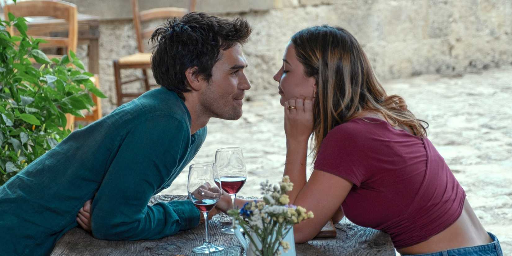Jack and Heather gaze at one another across a table in The Map that Leads to You