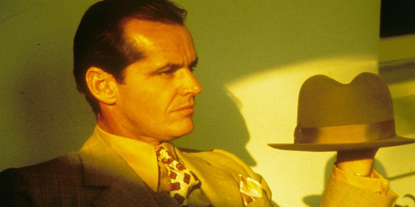 Jack Nicholson holds up his hat