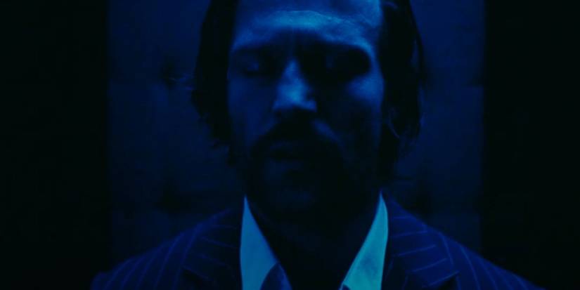 Jake (Jason Statham) trapped in the elevator in Revolver