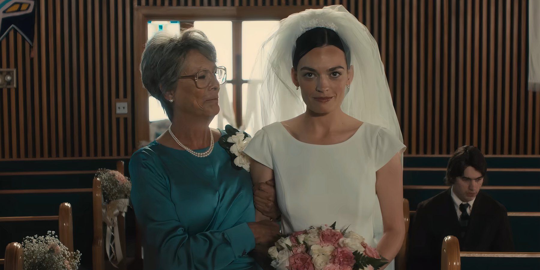 Jamie Lee Curtis and Ella Mackey dressed for a wedding in the comedy film Ella McCay