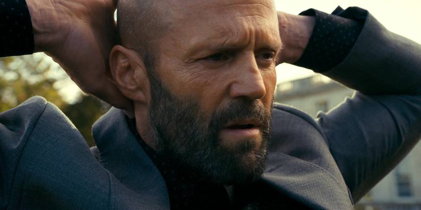 Jason Statham holding his hands behind his head in the Beekeeper