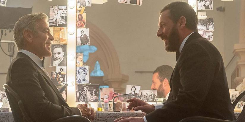 George Clooney and Adam Sandler laughing in Jay Kelly