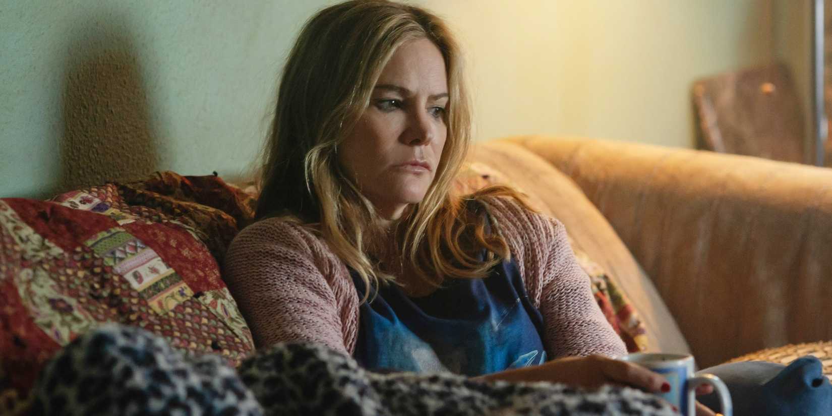 Jennifer Jason Leigh sips coffee as Doreen in Night Always Comes