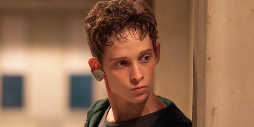 Joe Freeman as Luke Ellis looking around the corner in The Institute