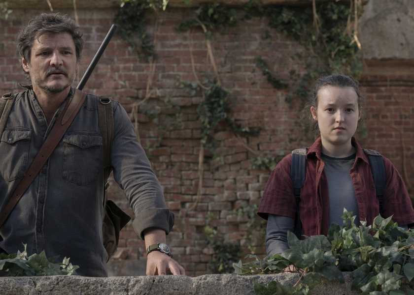 Joel and Ellie looking off-screen in The Last of Us