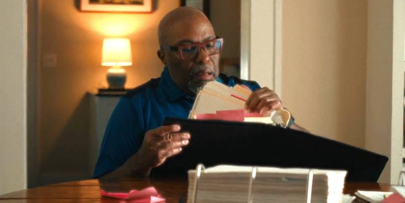 John Jones goes through a binder of information about the murders in HBO Max's The Yogurt Shop Murders