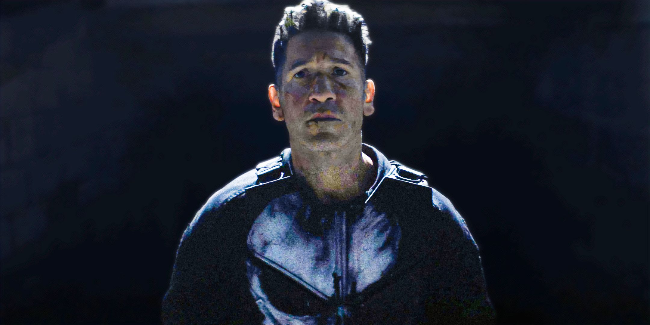Jon Bernthal's Punisher looking intense while walking down a dark hallway in Daredevil: Born Again