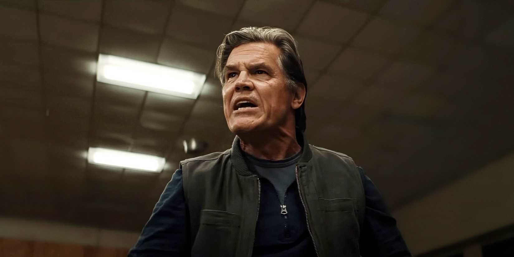 Josh Brolin standing up and yelling in Weapons