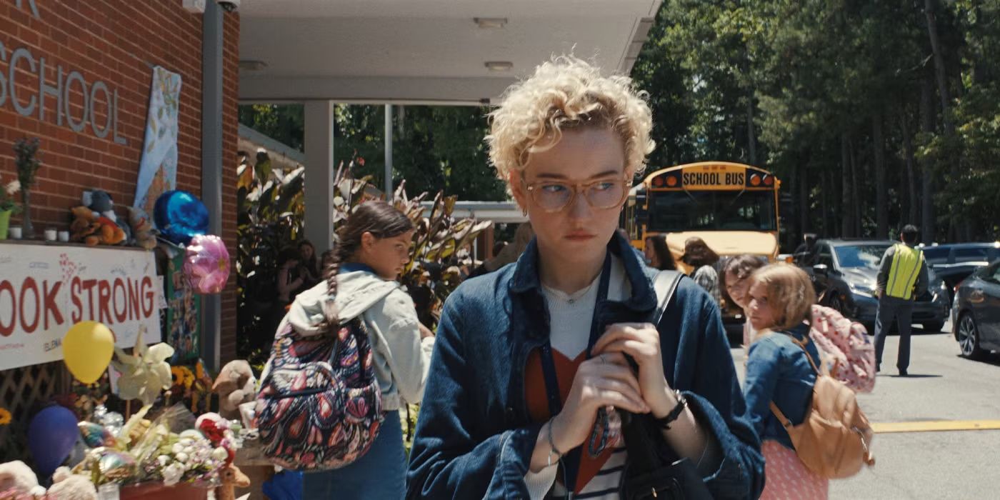 Julia Garner walking outside the school in Weapons