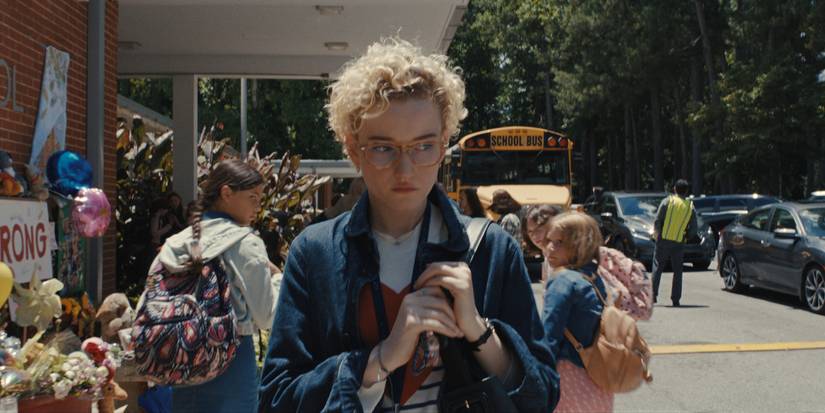 Julie Garner in front of a school in Weapons