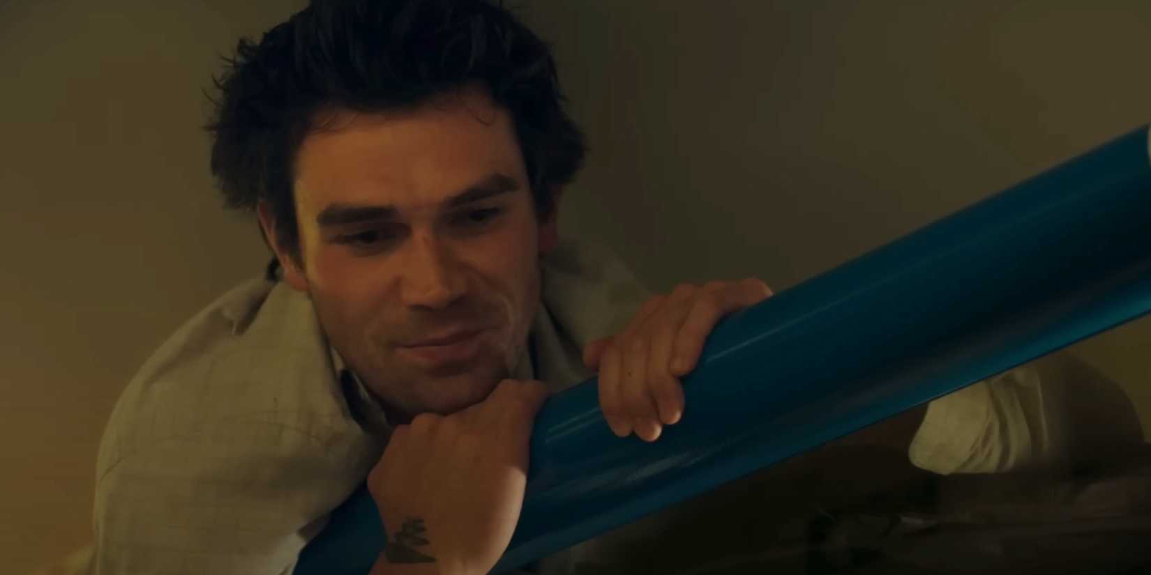 KJ Apa as Jack looks down on a train in The Map that Leads to You