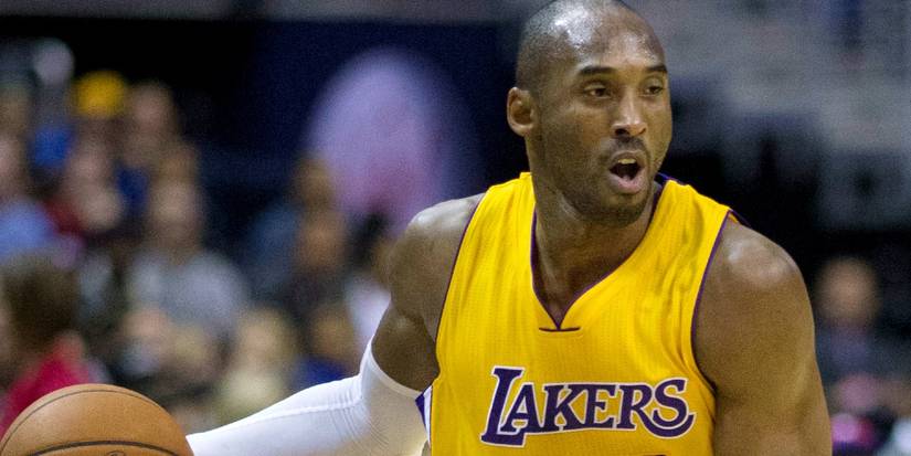 Kobe Bryant playing basketball for the Lakers