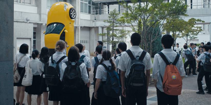 Kou and Yuta looking at the Principle's car in Happyend
