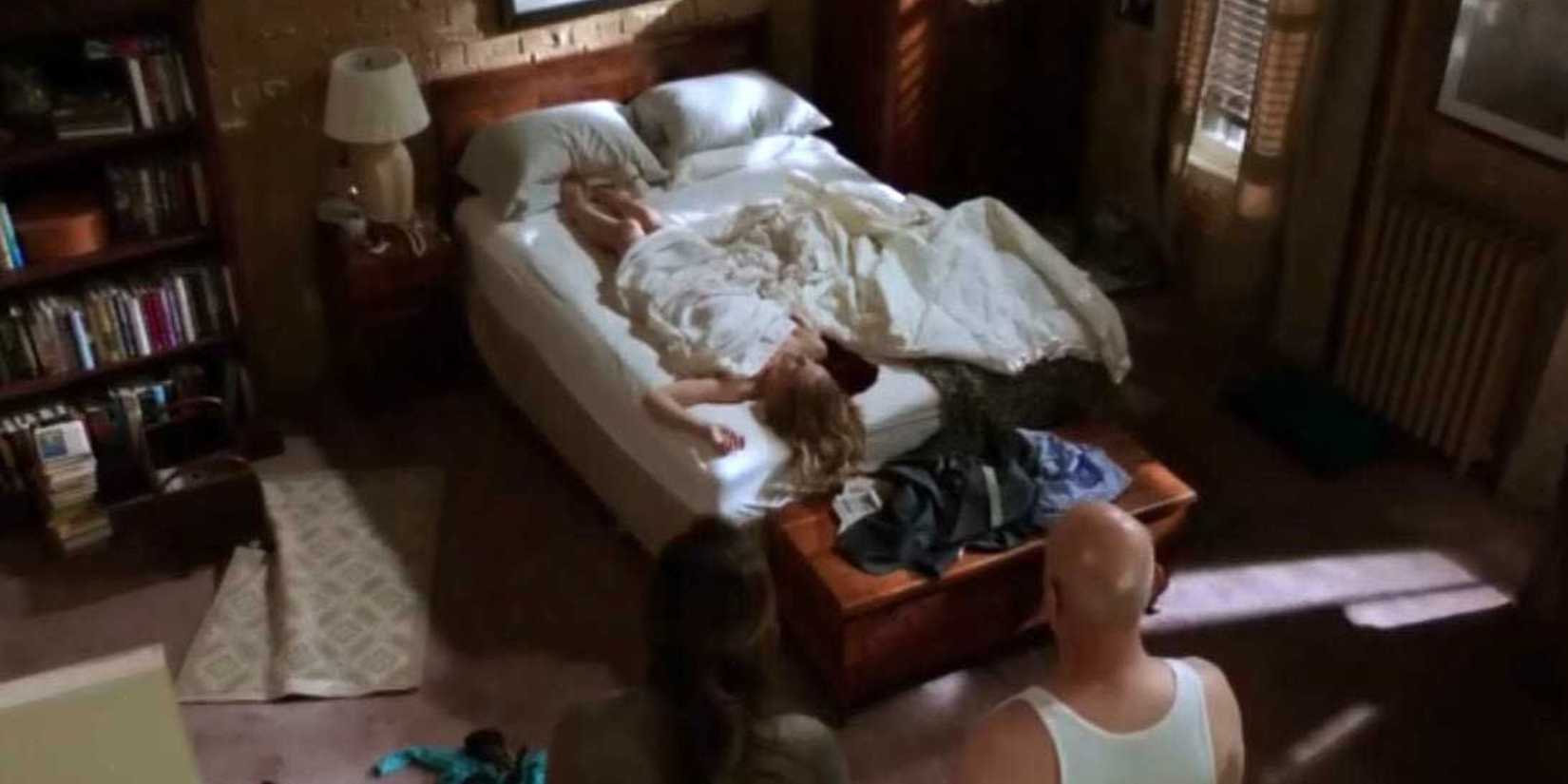 Law & Order SVU Cragen sitting across from a bed which has a corpse and a pool of blood on it