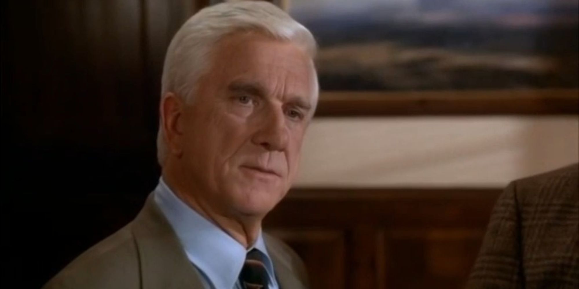 Leslie Nielsen as Frank Drebin in The Naked Gun