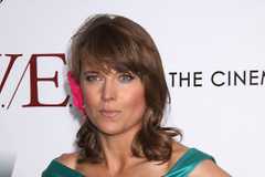 Lucy Lawless looking confused on the red carpet