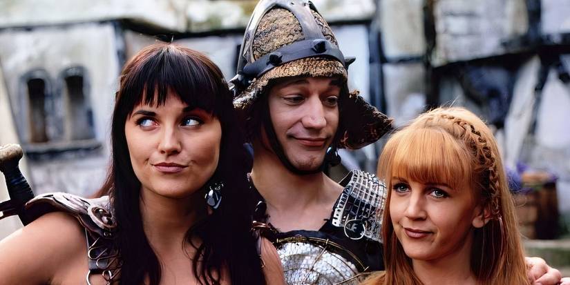 Lucy Lawless, Renee O'Connor, and Ted Raimi standing together from Xena Warrior Princess