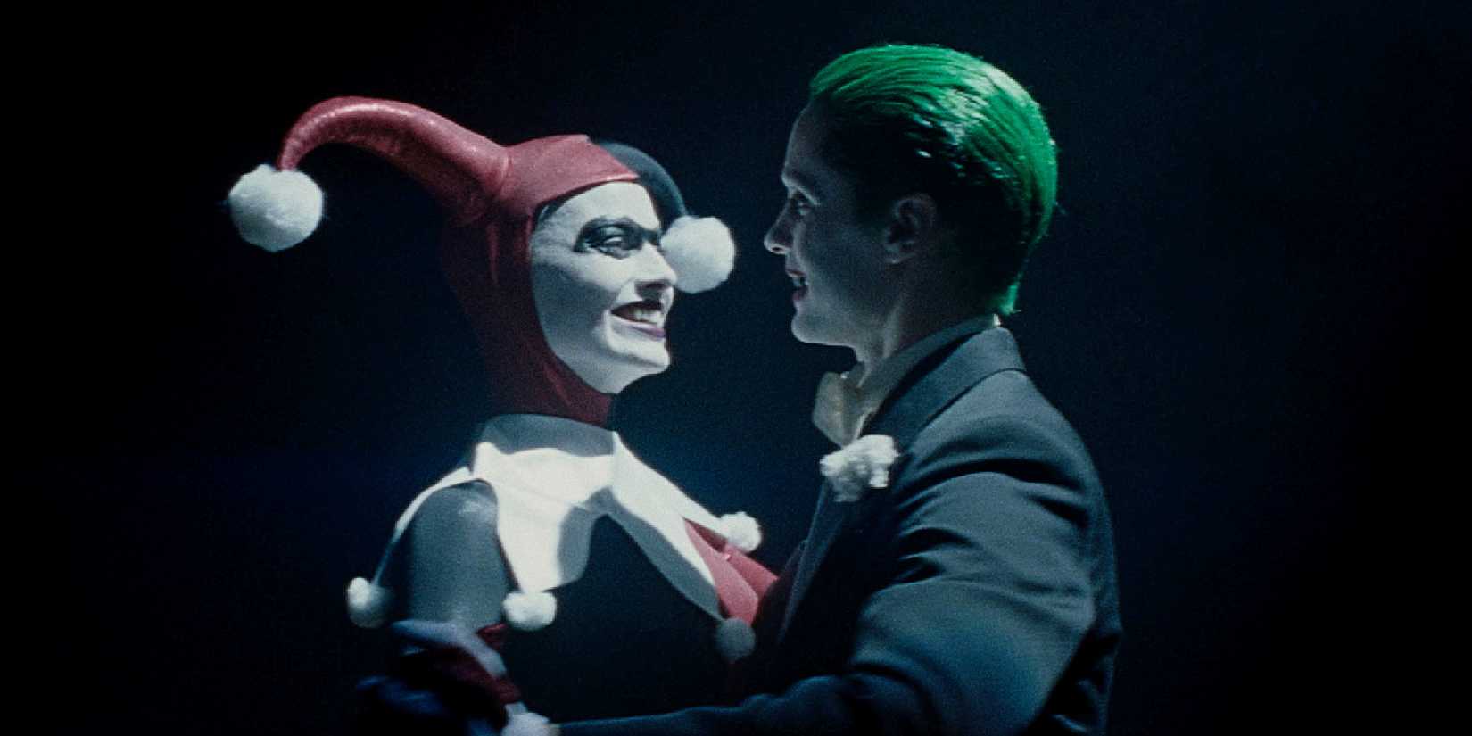 Margot Robbie's Harley Quinn and Jared Leto's Joker dance wearing their classic costumes in Suicide Squad