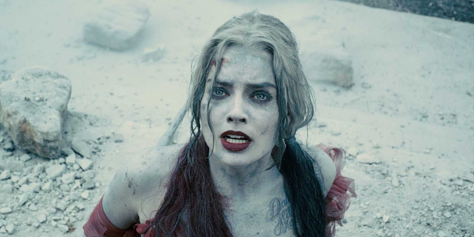 Margot Robbie's Harley Quinn is covered in dirt in The Suicide Squad