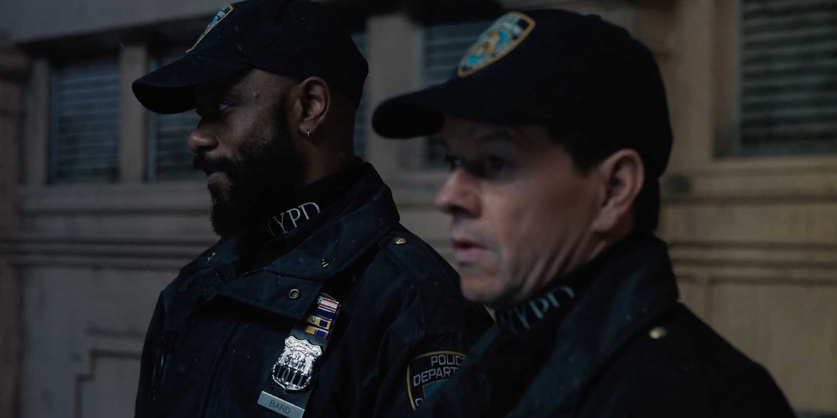 Mark Wahlberg and LaKeith Stanfield dressed as NYPD officers in Play Dirty