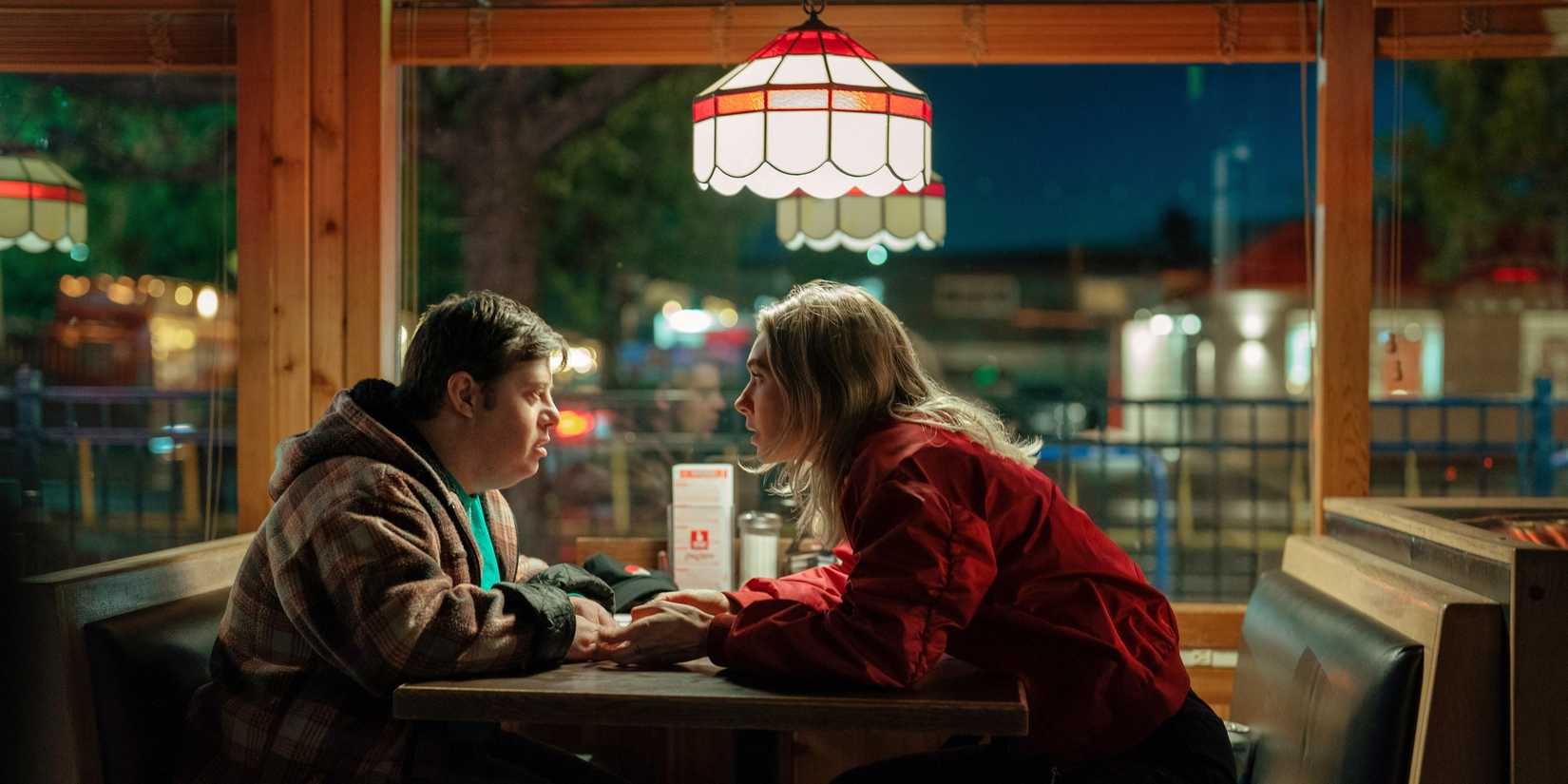 Lynette and Kenny sitting at a table in a diner in Night Always Comes.