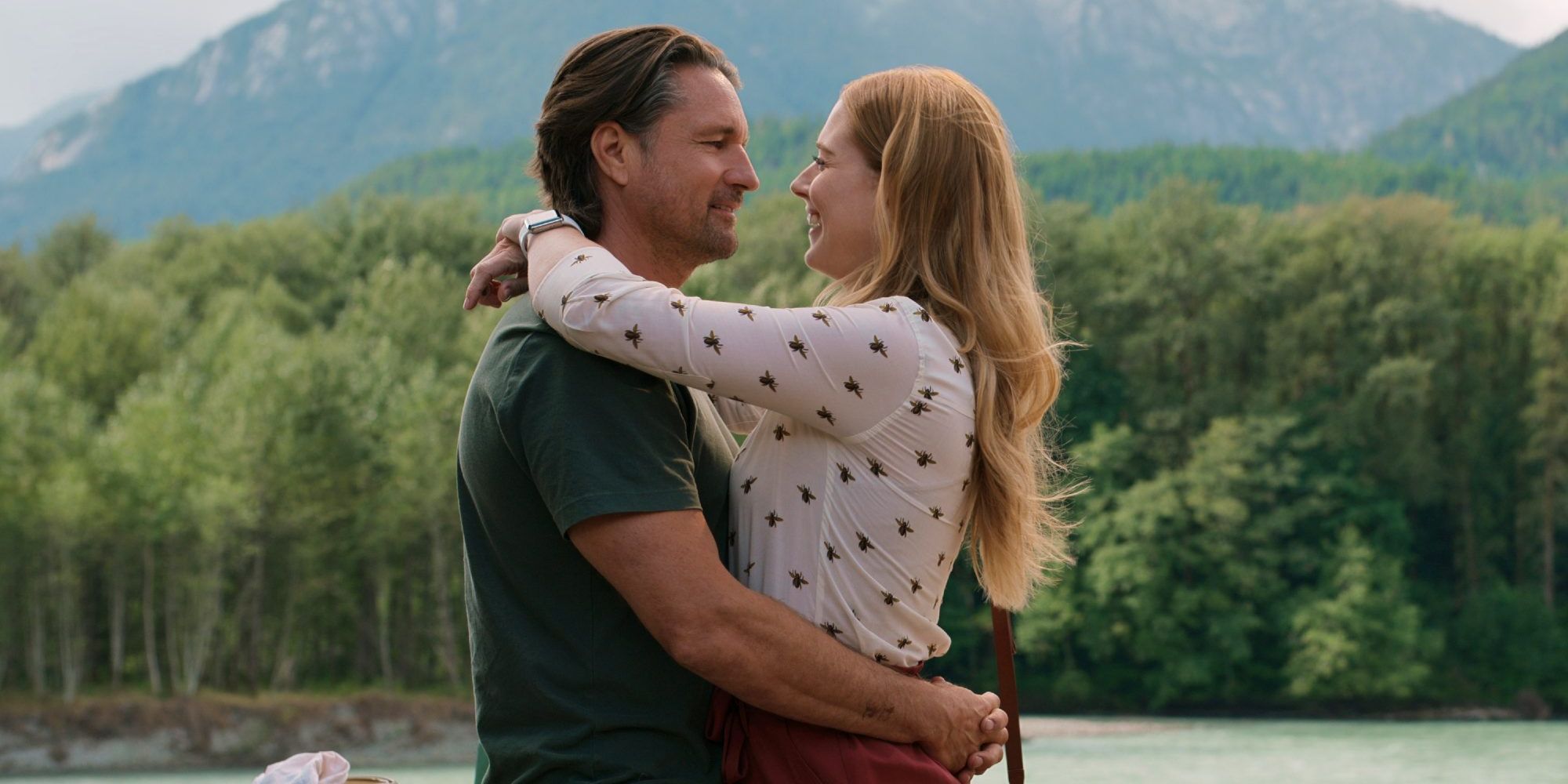 Mel (Alexandra Breckenridge) and Jack (Martin Henderson) hugging and smiling in Virgin River.