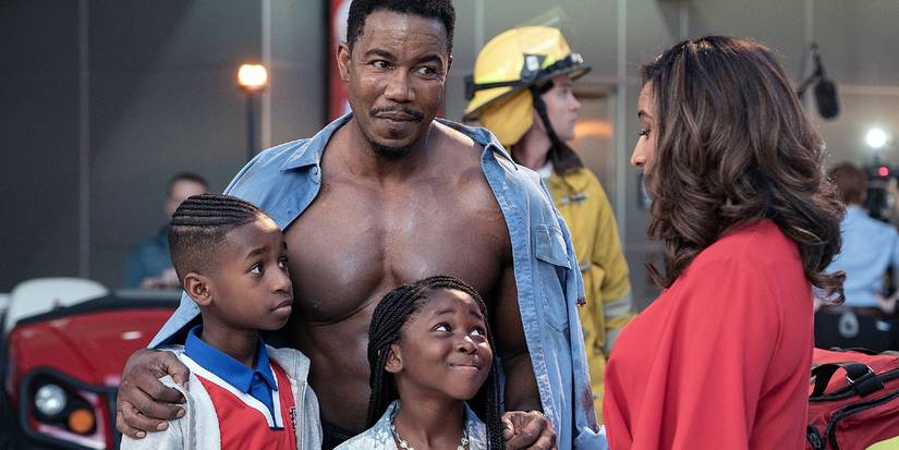 Michael Jai White as Jesse Freeman standing with his family in Welcome to Sudden Death