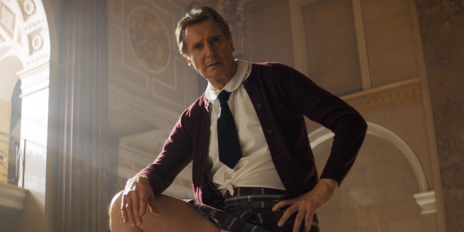 Liam Neeson poses as Frank Drebin Jr in The Naked Gun