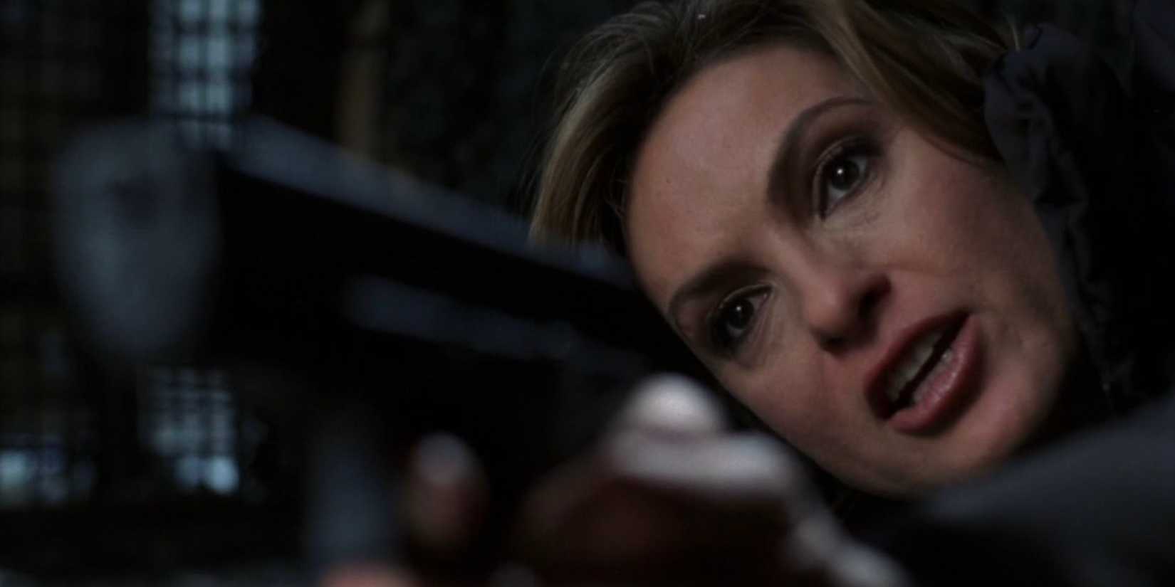 Oliva Benson (Mariska Hargitay) upset and on the ground holding a gun in the Law & Order: SVU episode "Fault"