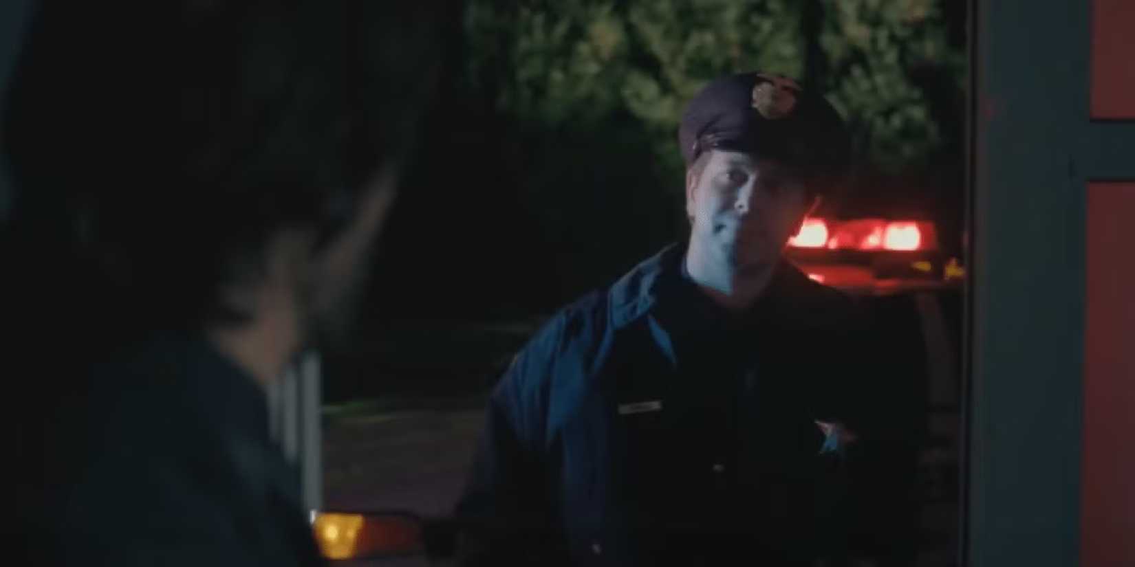 Police officer Jimmy at John Wick's home