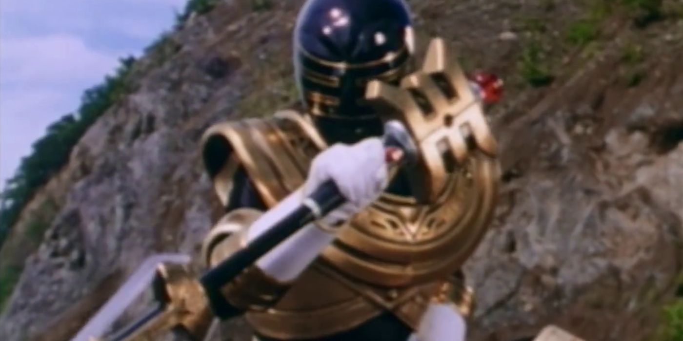Power Rangers Zeo's Gold Ranger holding his staff