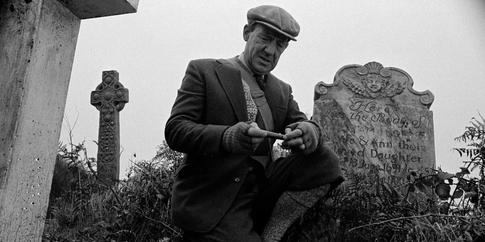 Professor Parkins uncovers the whistle from the graveyard in Whistle and I'll Come to You.