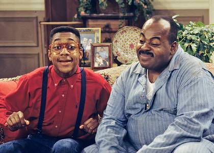 Reginald VelJohnson and Jaleel White sitting together on the set of Family Matters when they were young