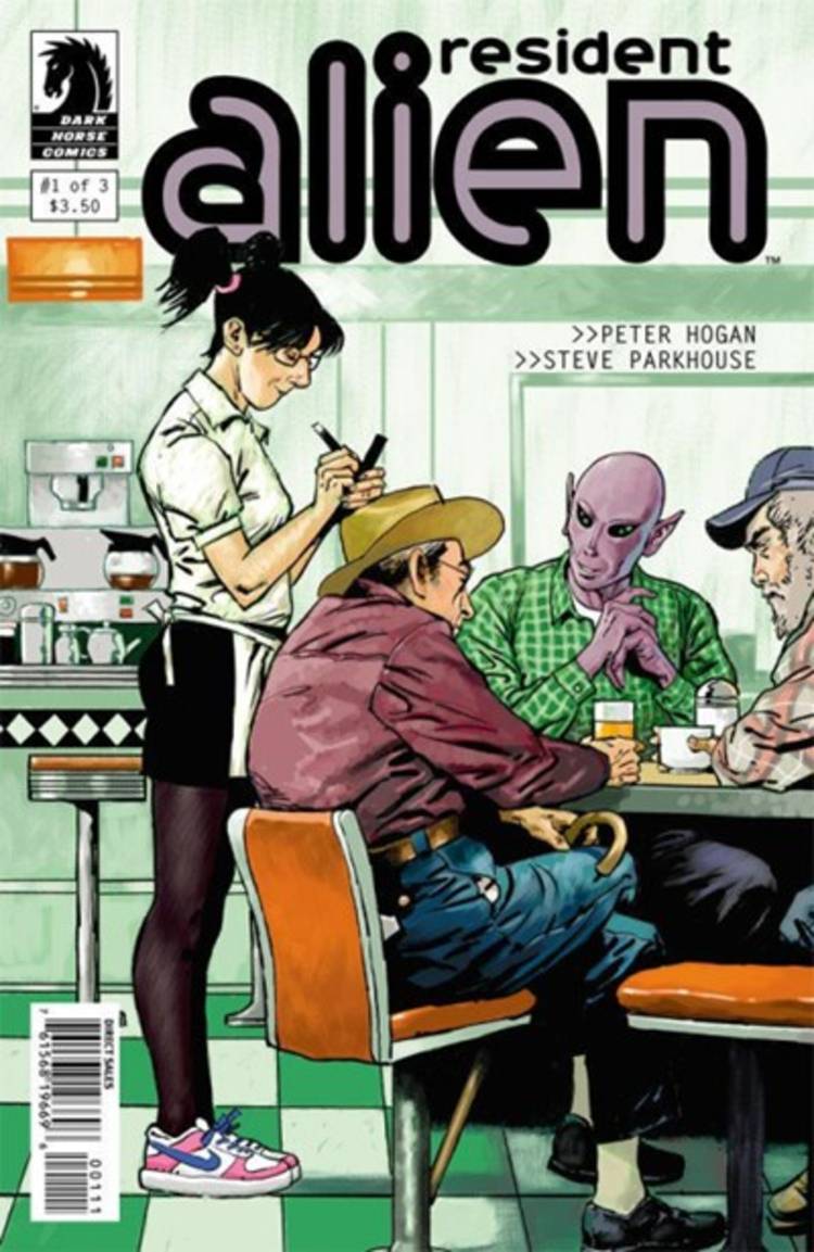 Resident Alien #1 cover, Harry seated at a diner table with human characters