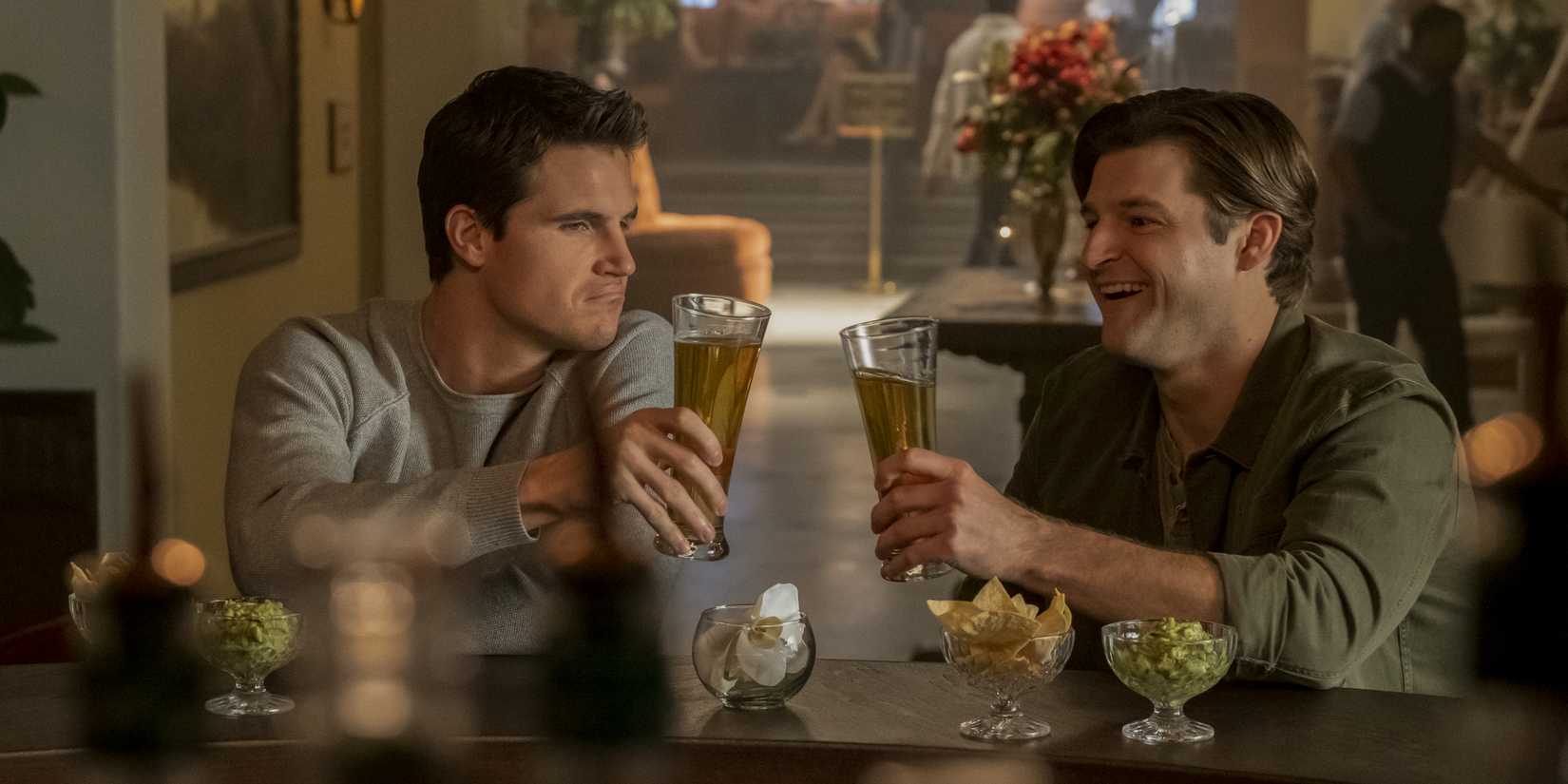 Robbie Amell and Luke Crossley from Upload celebrating together