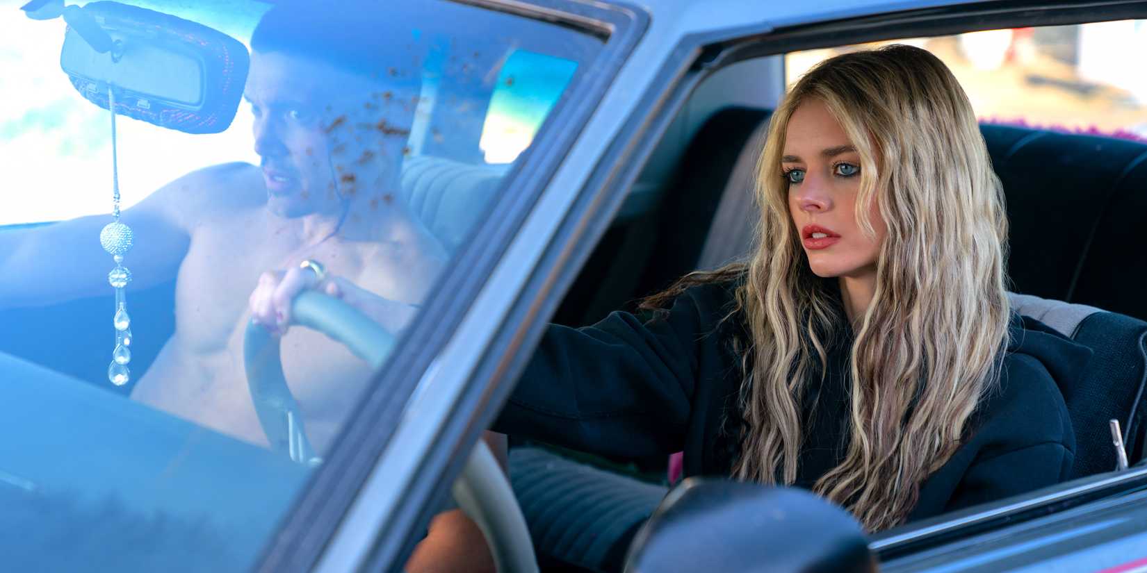 Samara Weaving viewed through the open window of a car in Eenie Meanie