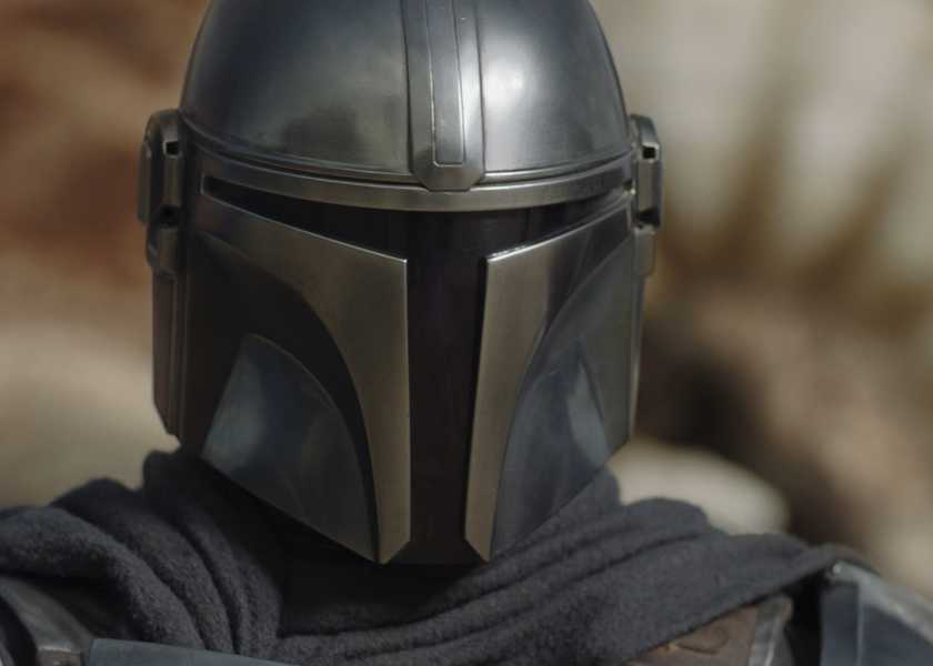 Din Djarin (Pedro Pascal) keeps his helmet focused on the krayt dragon fight on Tatooine in a super close-up.