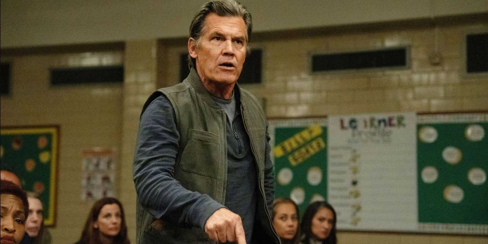 Josh Brolin as Archer Graff looking angry at a community meeting in Weapons