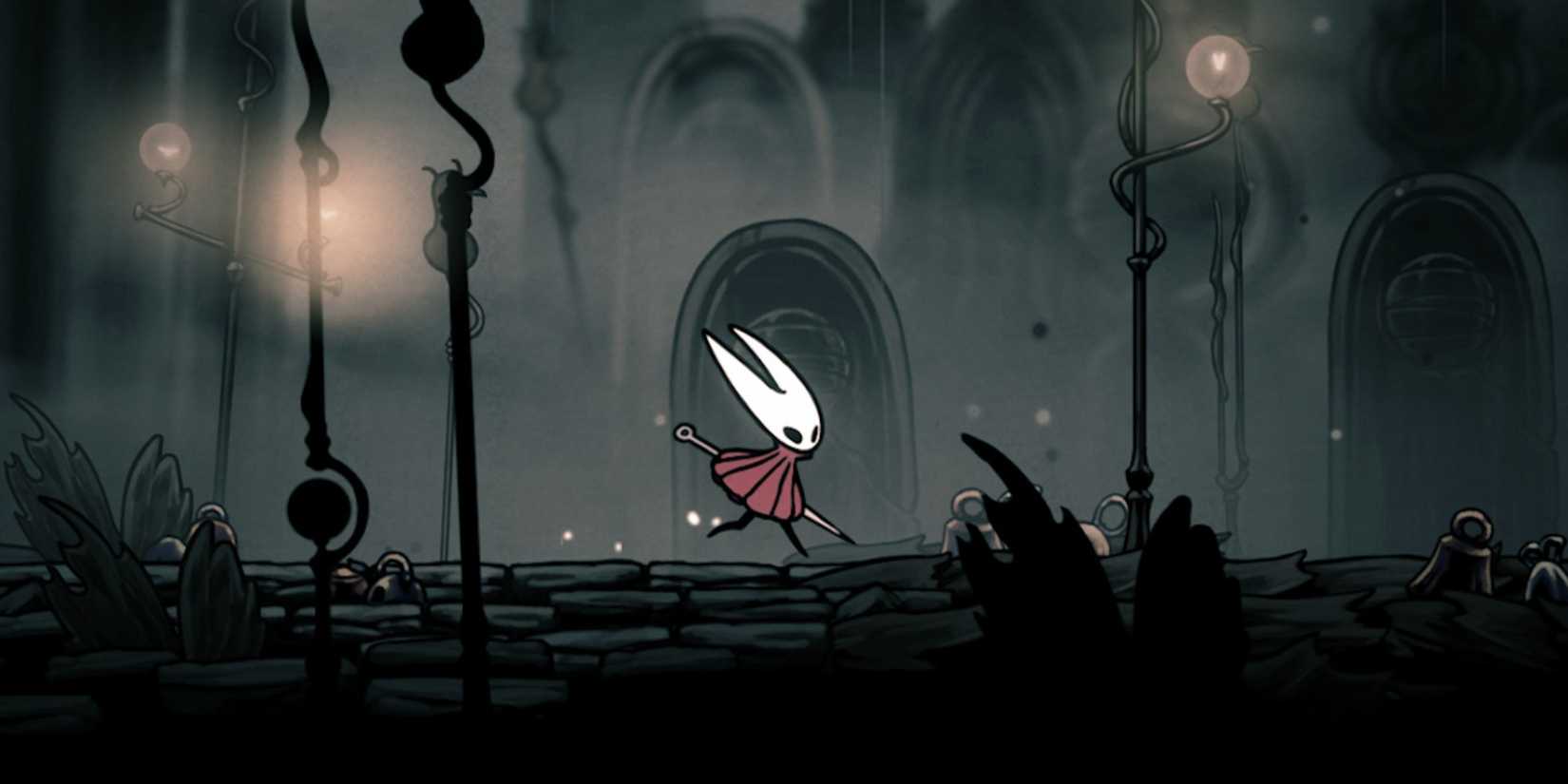 Silksong hornet walking through a black and white landscape with lamps around her