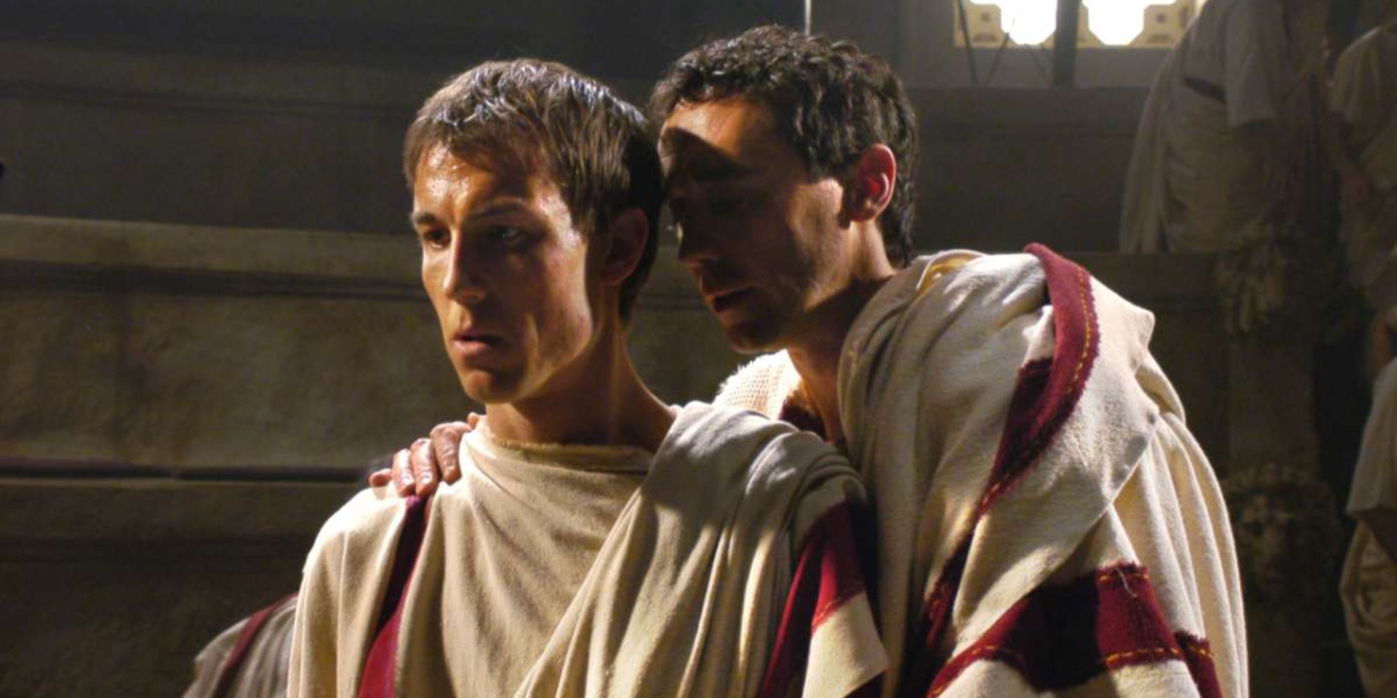 Someone whispering to Brutus (Tobias Menzies) in Rome