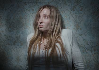 Sophie Turner in a wallpapered room in Trust