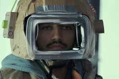 Frank (Nabhaan Rizwan) staring through an isolation suit in STATION ELEVEN âGoodbye My Damaged Home', (Season 1, ep. 107, aired Dec. 30, 2021) (1)