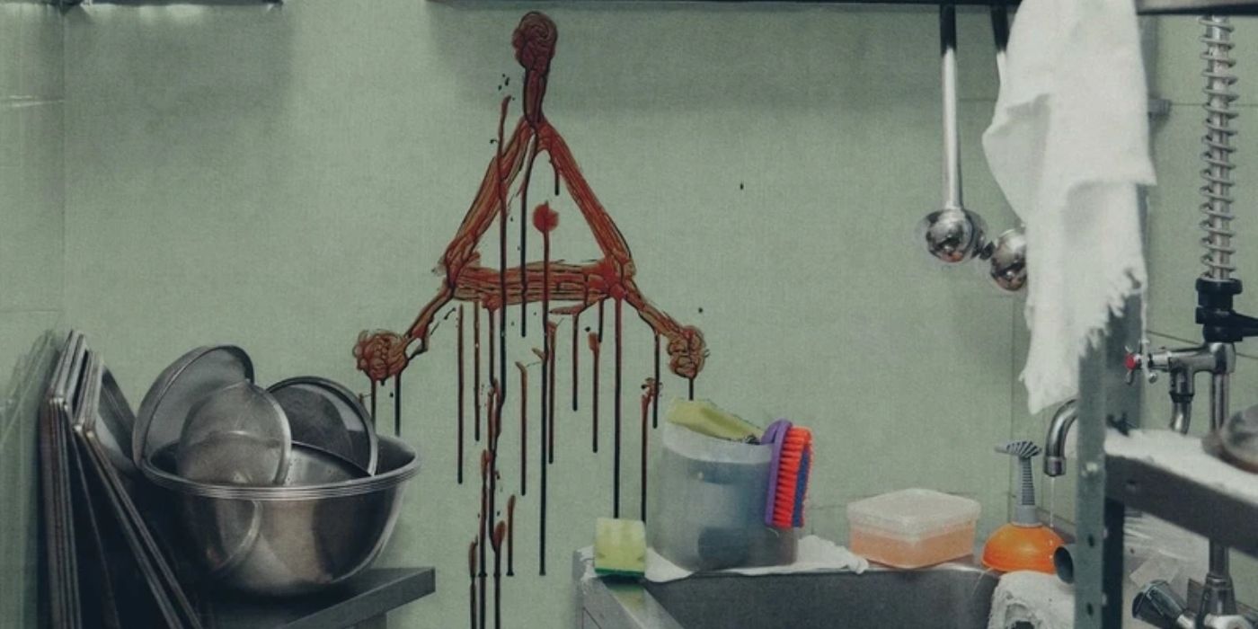 Triangle symbol painted with blood in Strange Harvest